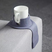 Silicone Couch Cup Holder placed securely on a gray sofa armrest